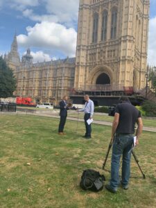 Prof Mark Mon-Williams being interviewed outside Houses of Parliament.